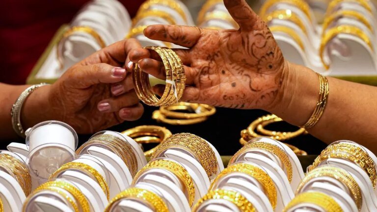 Gold prices hit record highs, affecting demand during festival season.