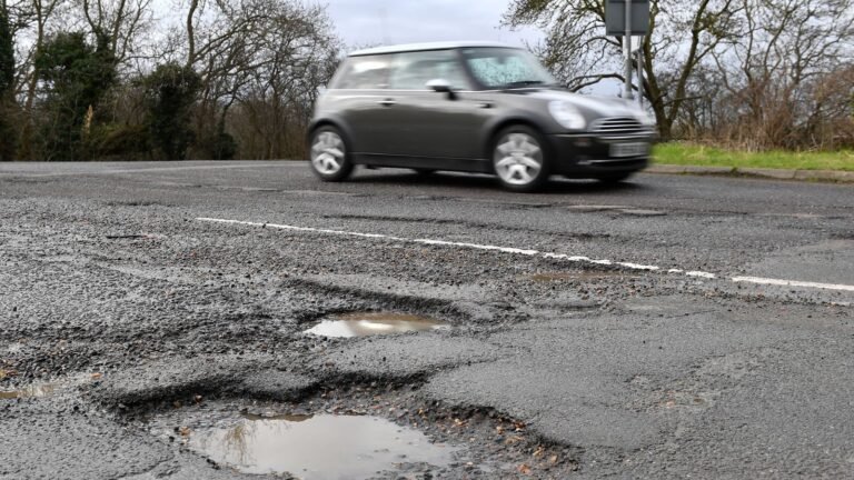 Potholes: Councils told to ‘get on with the job’ of fixing ‘broken roads’ | UK News