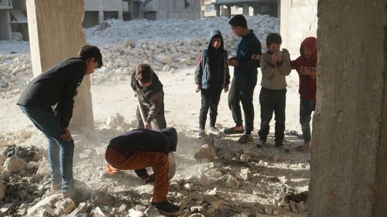Children dig up bones on street where at least 41 murdered in Syria pit massacre | World News