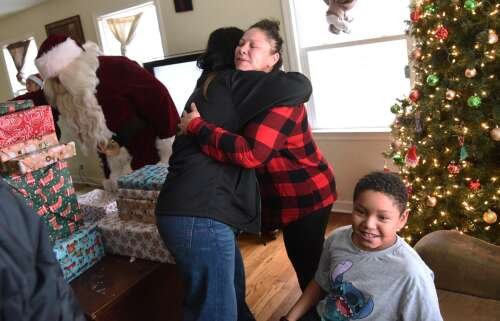 Santa, firefighters bring Christmas cheer to Elgin family