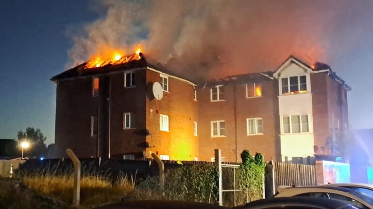 Three children taken to hospital after fire tears through three-storey block of flats in Enfield | UK News