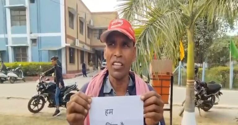 ‘We are alive sir…’ Husband roaming around with a placard around his neck, wife taking widow pension