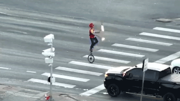 Fire-juggling unicyclist stops Colorado traffic at busy intersection