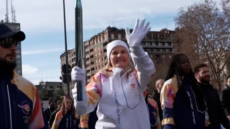 Olympic torch travels through central Milan hours before games | Olympics