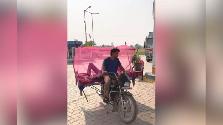 Made the man lie down on the bike along with the cot, tied a mosquito net along with it! Then the boy came to fill petrol