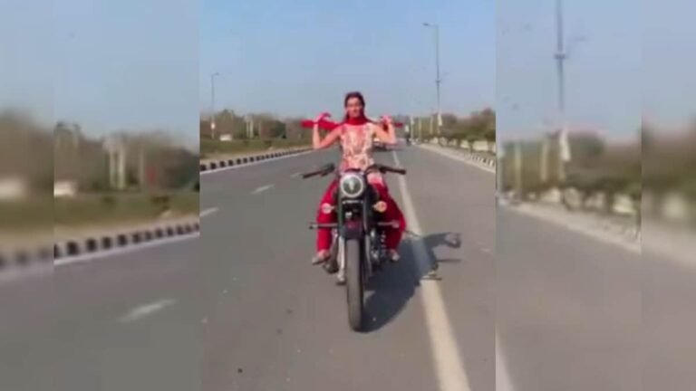 Girl dressed in Holi colors, seen performing stunts on bike in the middle of the road, viral video on social media!