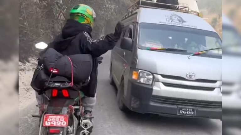 The car was overtaking on the wrong side of the mountain, the biker got angry, punched and broke the glass!