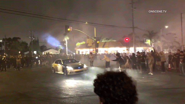 LA street takeover traps Metro bus, riders watch as crowd vandalizes it