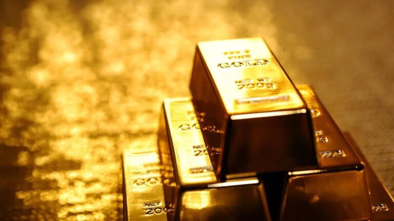 Gold climbs more than 2% on softer dollar, easing expectations of higher rates