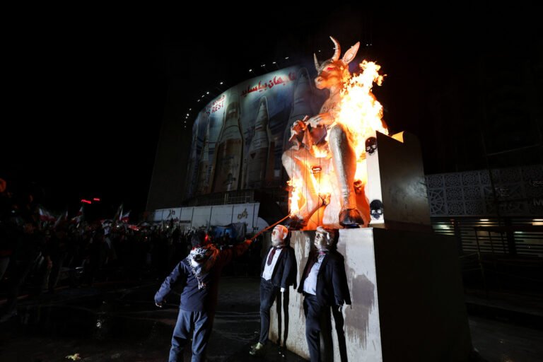 Iranians burn Trump, Netanyahu effigies at warship victim rally