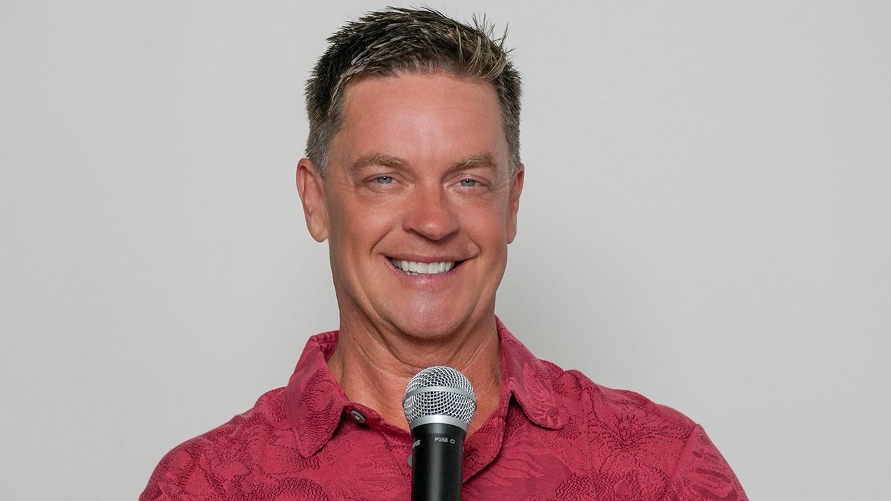 jim-breuer-holding-microphone.jpg