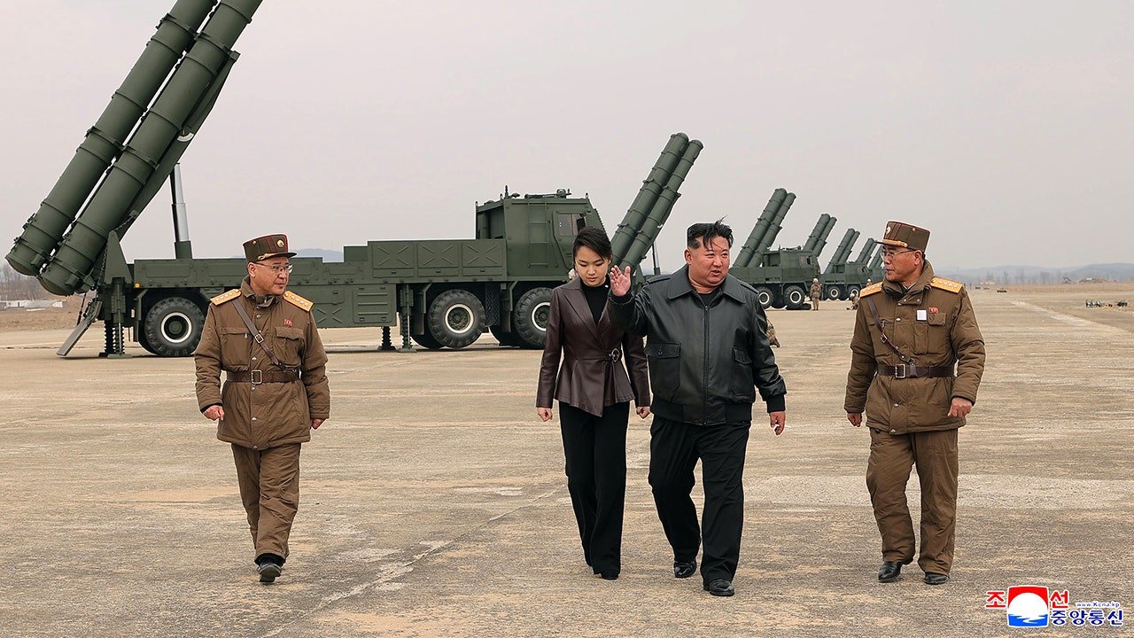 kim-jong-un-and-daughter-missile-test.jpg