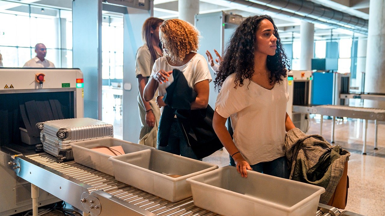 woman-going-through-airport-security.jpg