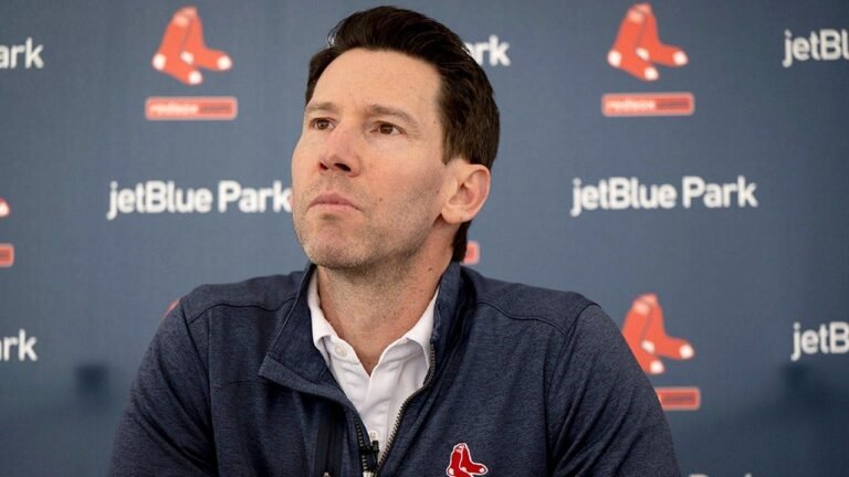 Did Boston Red Sox GM replace most of their coaching staff because of one player?