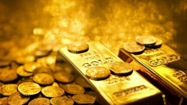 Gold on track for third weekly loss on firm dollar, hawkish Fed signals
